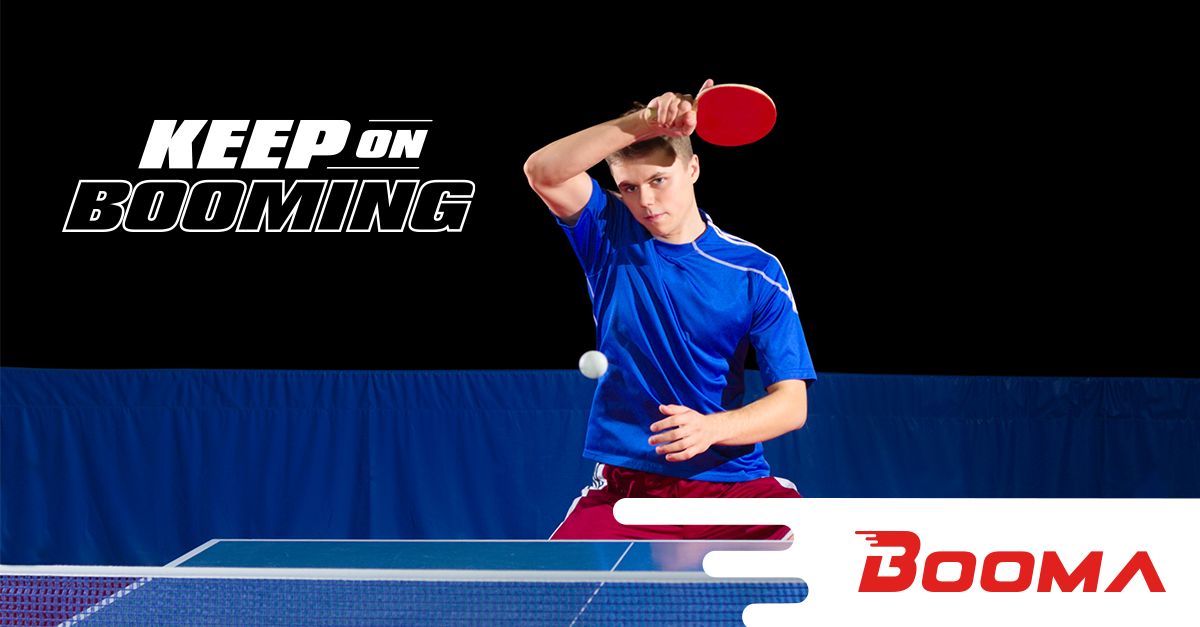 A young man using strategies to hit the ping pong ball over to net to complete his shot.