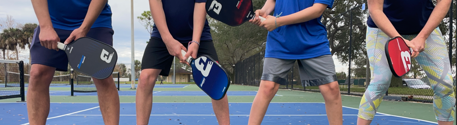 BOOMA family on pickleball court.
